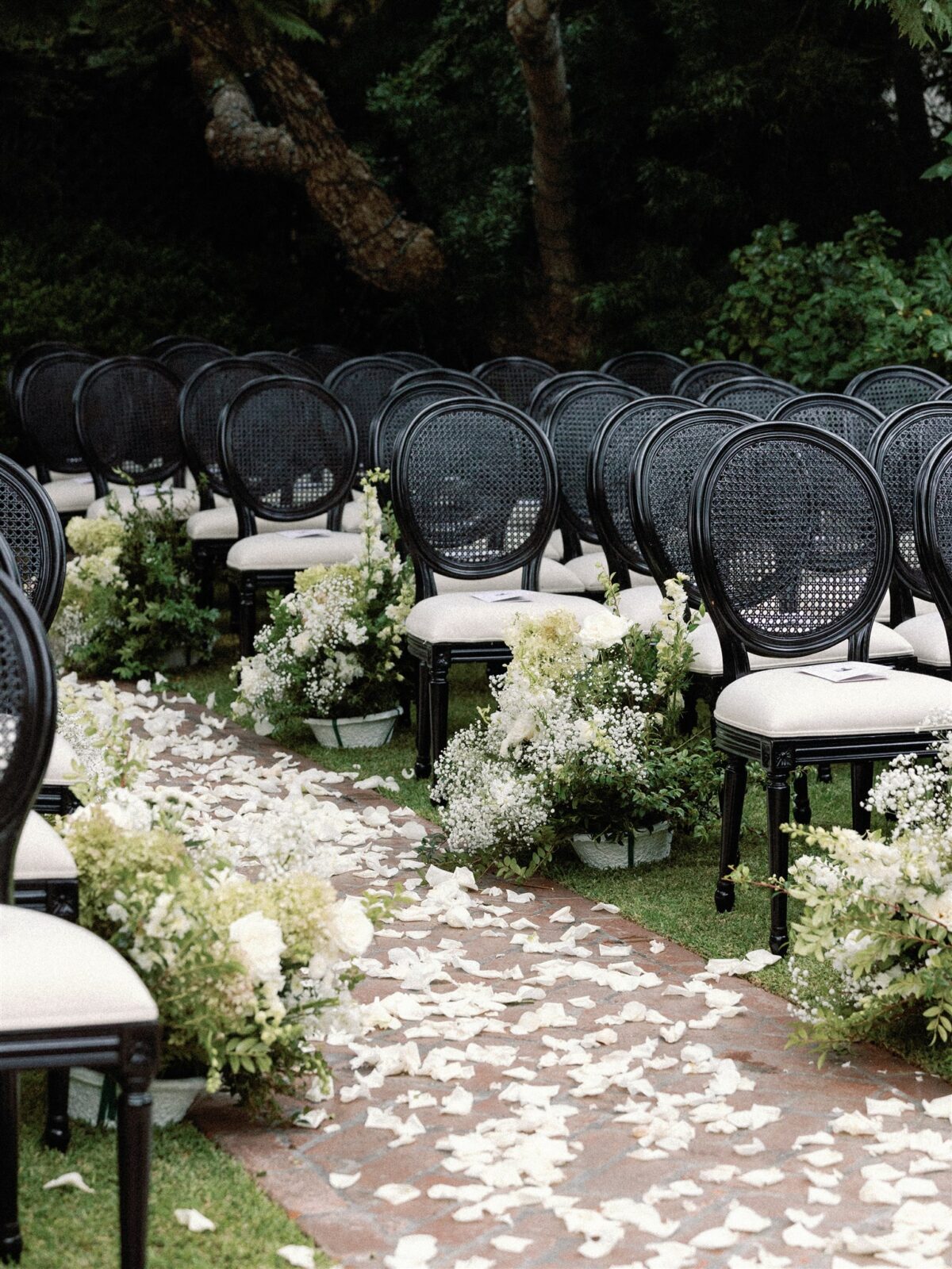 Modern black garden chairs at La Jolla Women's Club wedding ceremony