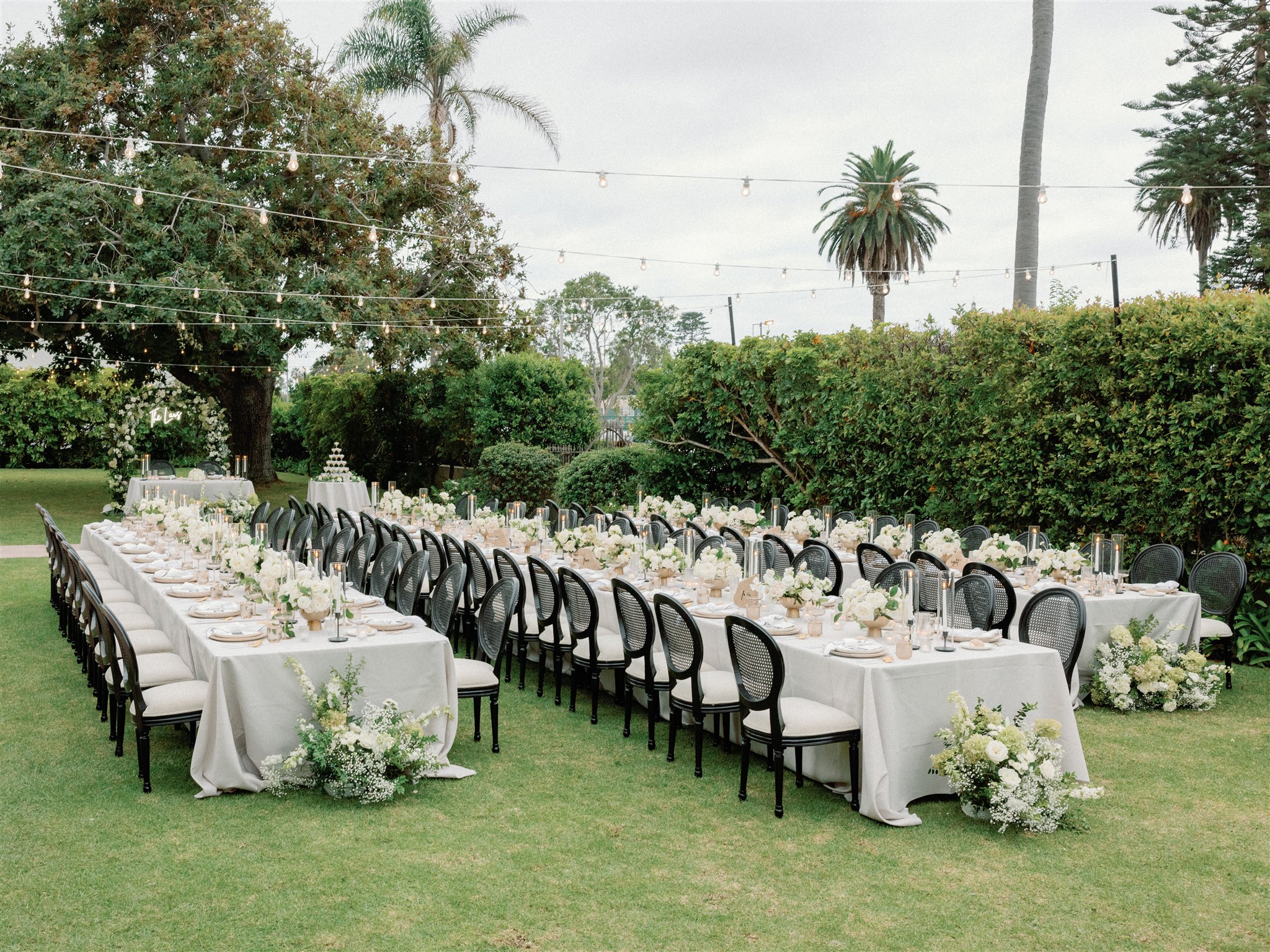 Garden wedding reception at the La Jolla Women's Club with greens, white and black details