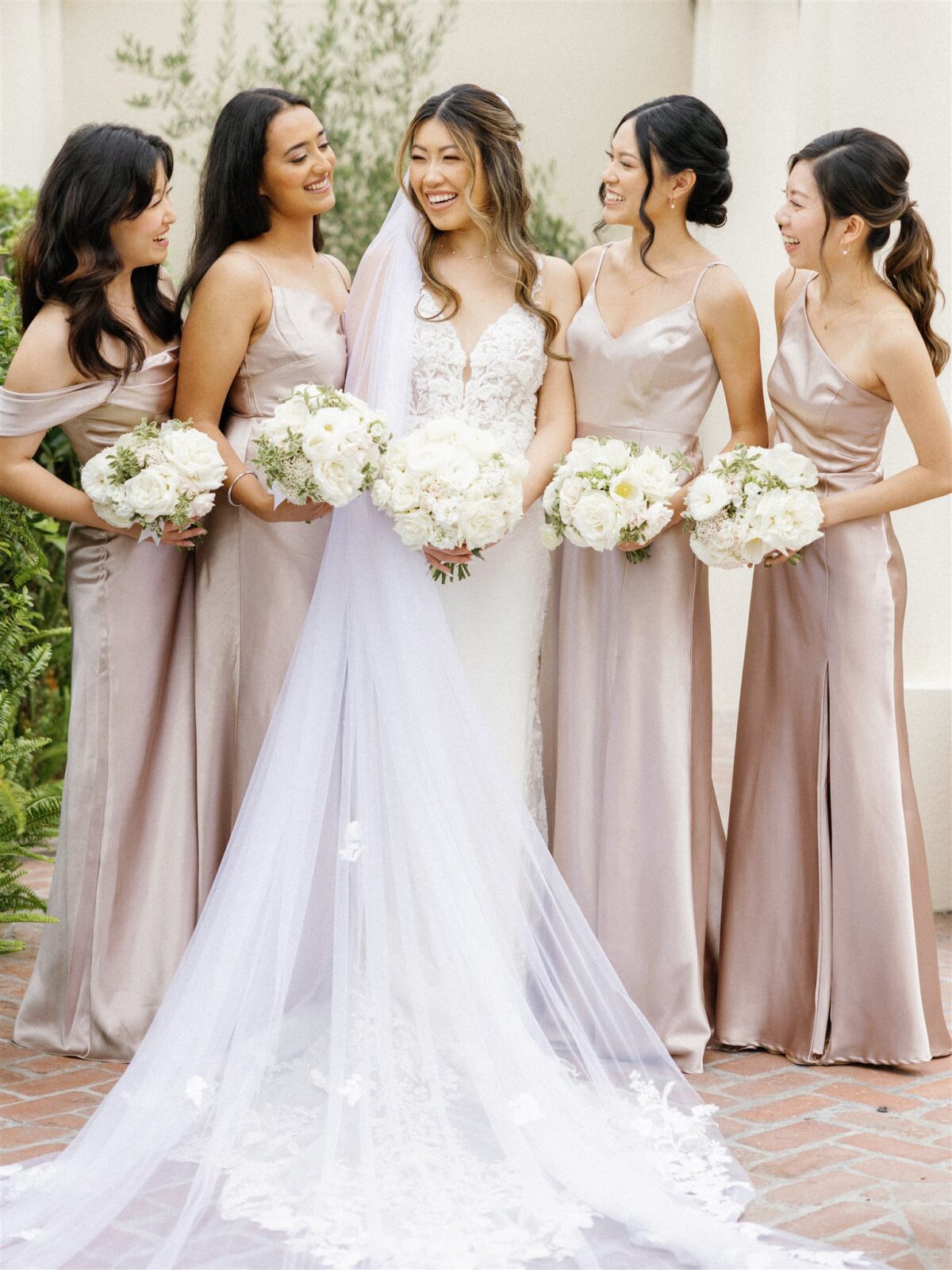 bride and bridesmaids smiling at La Jolla Women's Club