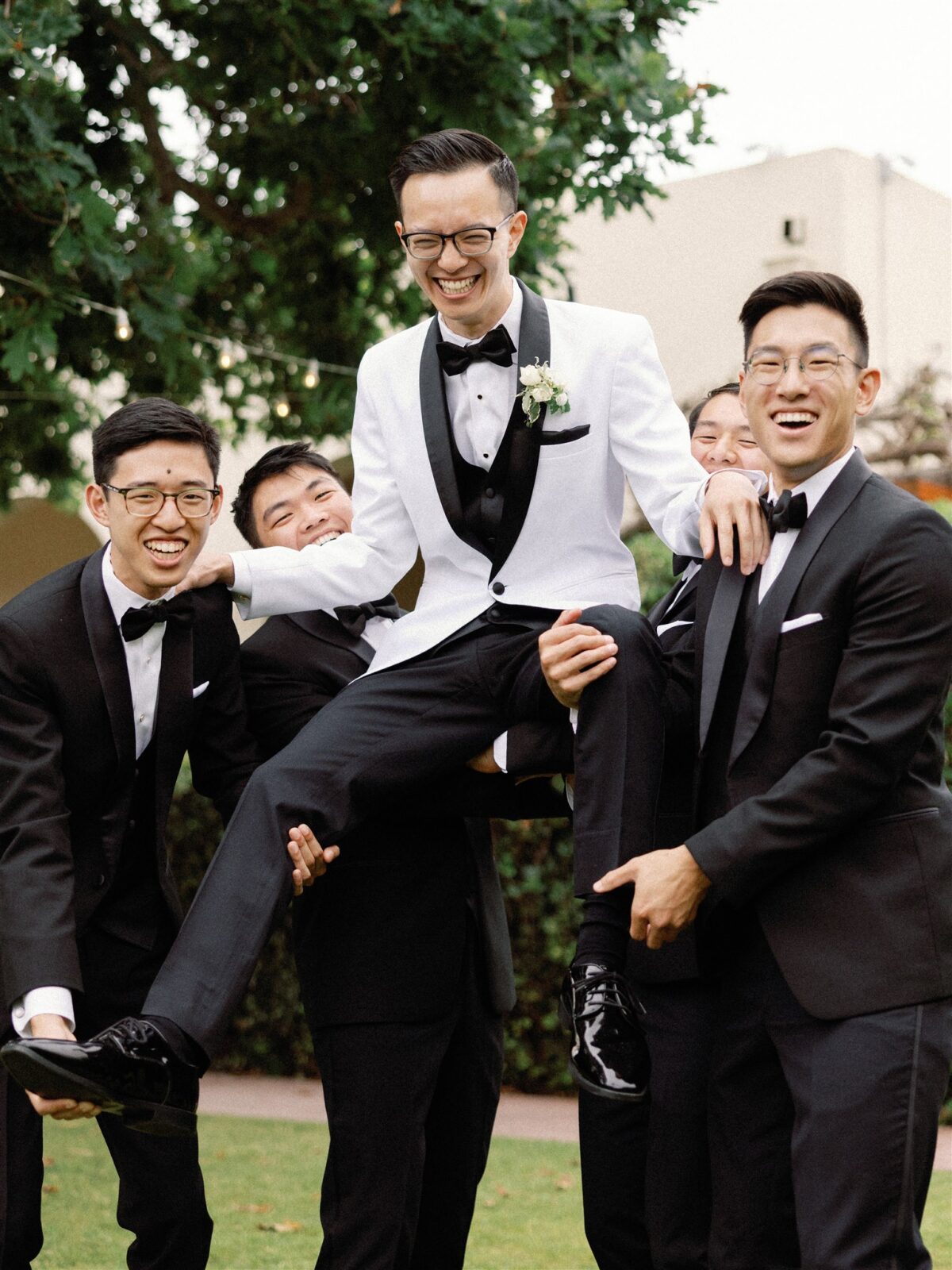 Groom and groomsmen posing at La Jolla Women's Club