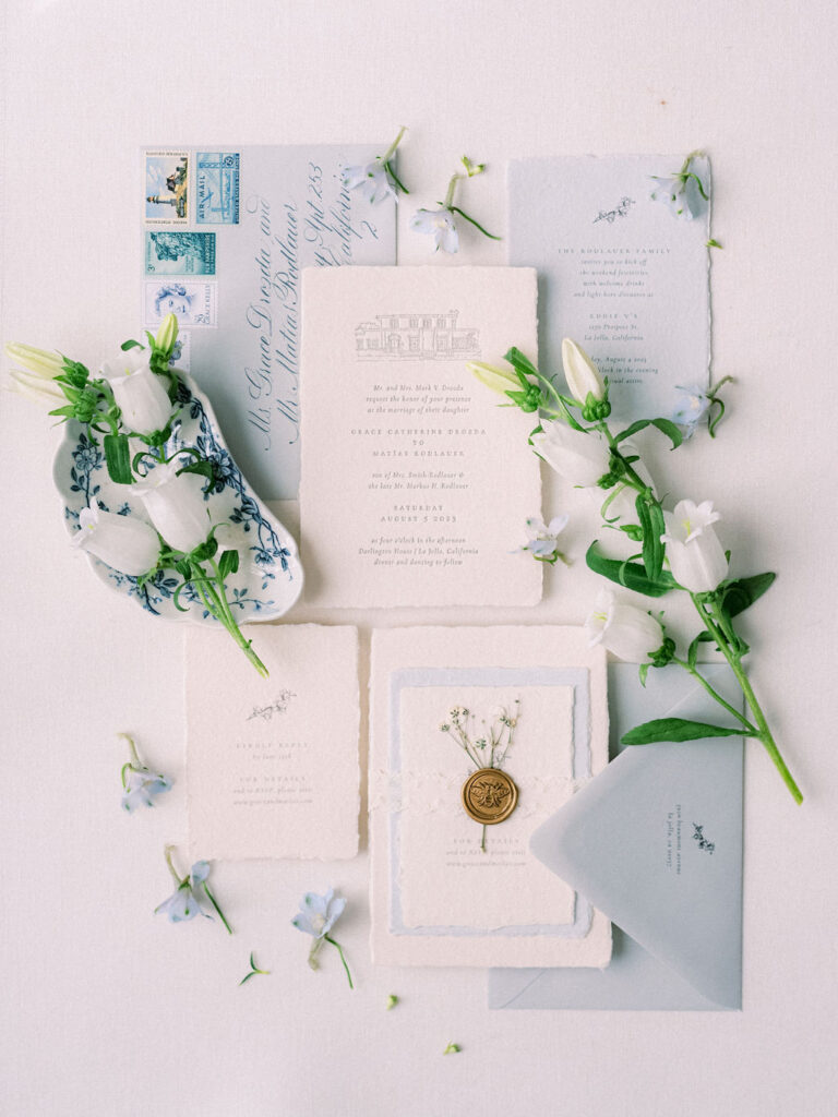 white and blue wedding invitation