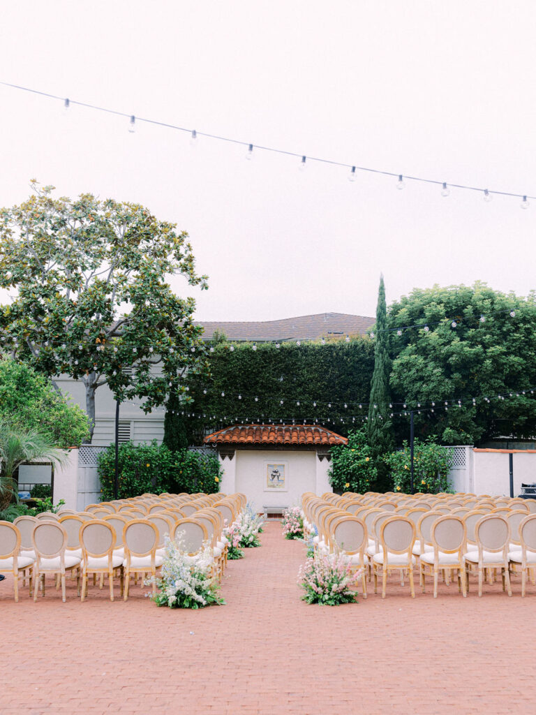 Wedding ceremony in the rose garden at the Darlington House in La Jolla, CA