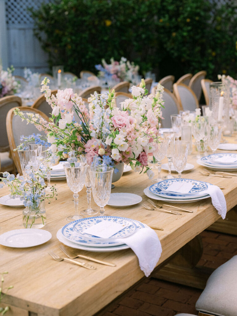 pastel colored centerpieces on a wood table