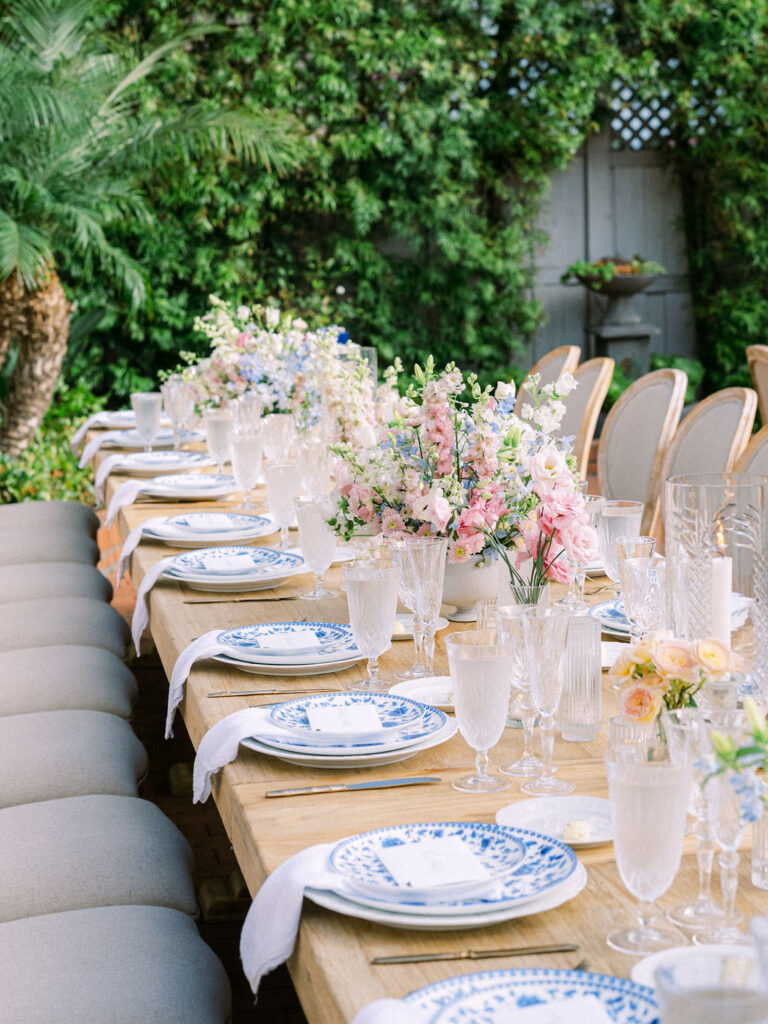 Wedding reception centerpieces with blue patterned plates