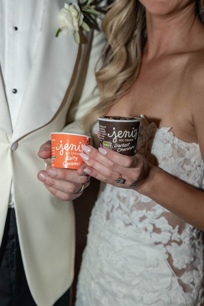 bride and groom holding ice cream at Scripps Seaside Forum