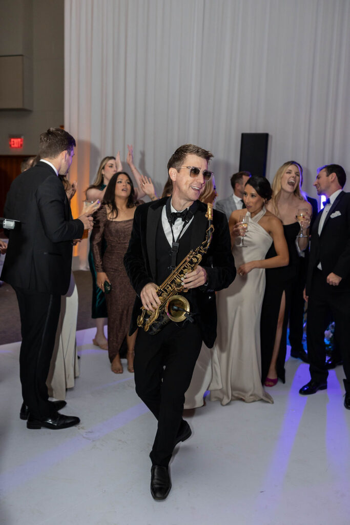 saxaphonist playing at wedding at Scripps Seaside Forum