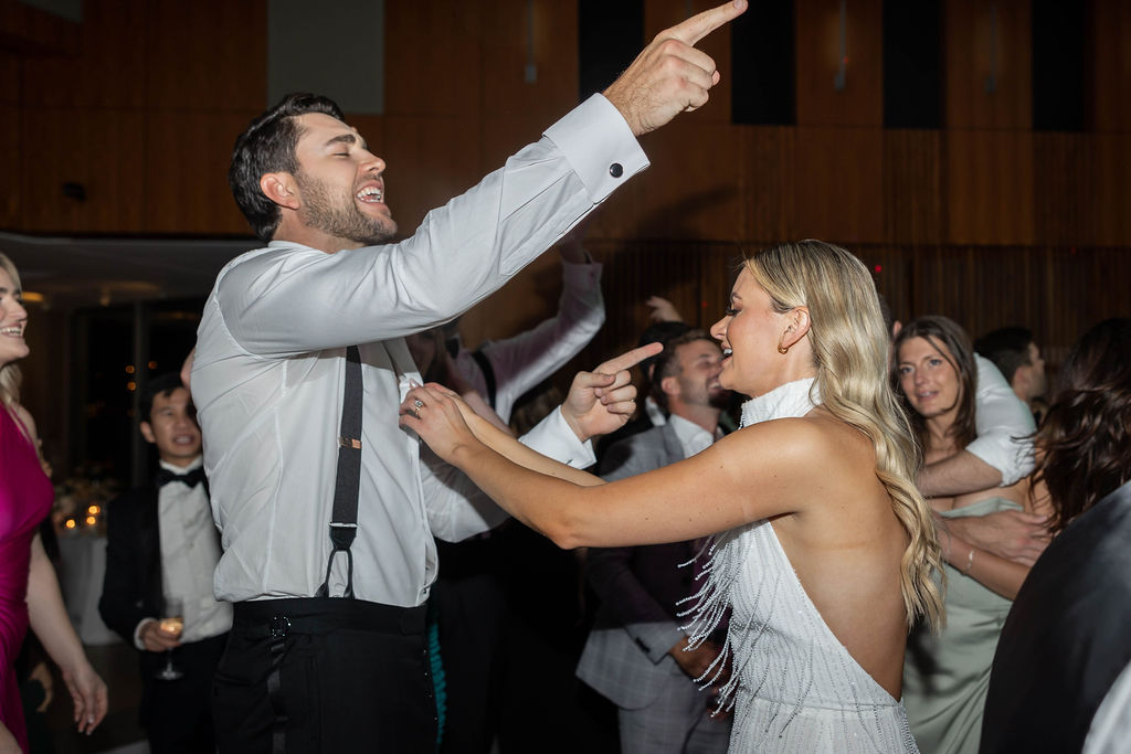 bride and groom dancing at their wedding reception at Scripps Seaside Forum