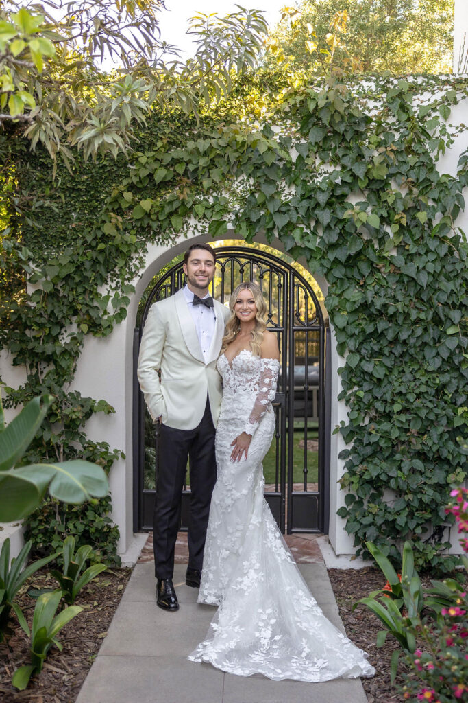 bride and groom posing at the Orle Hotel in La Jolla