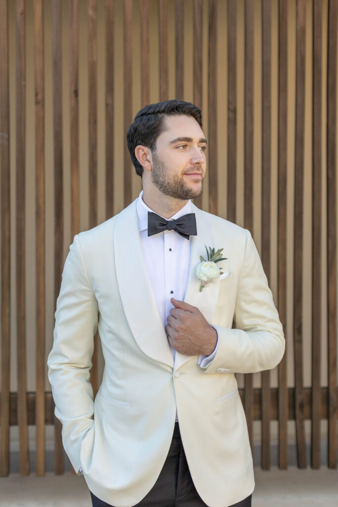 Groom posing at scripps seaside forum