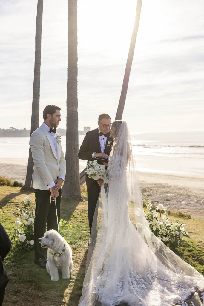 Bride and groom at front of ceremony at Scripps Seaside Forum