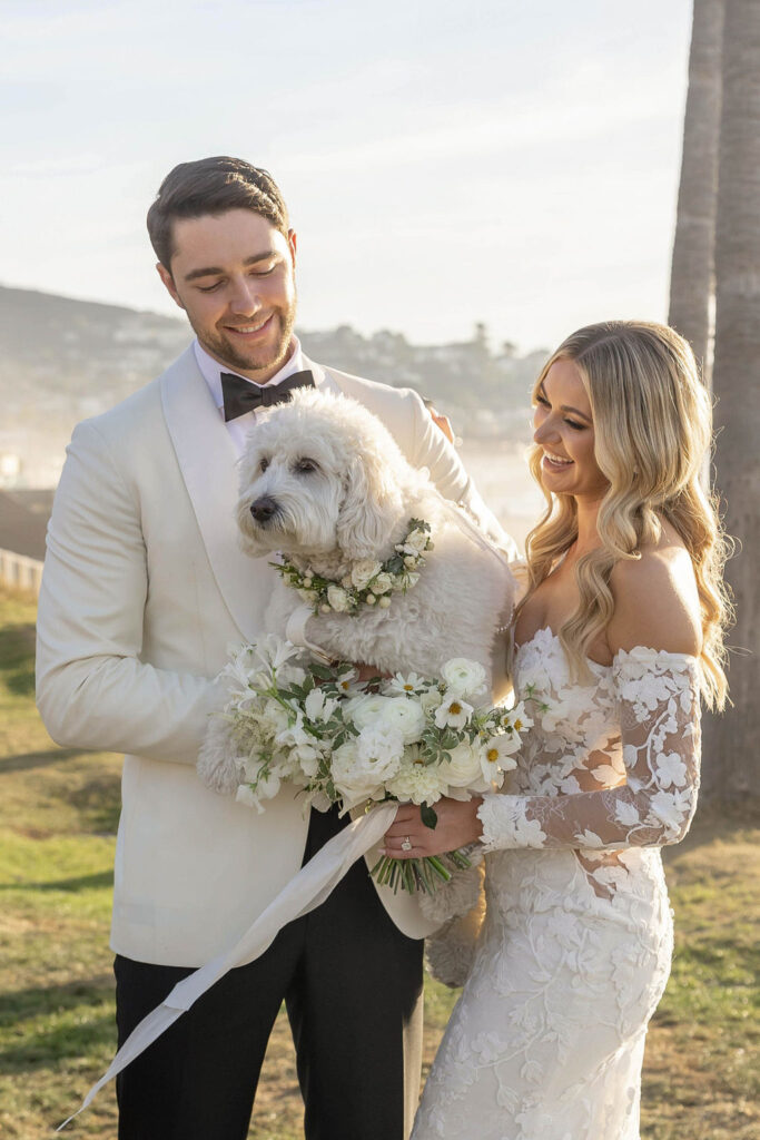 Bride and groom with their dog at Scripps Seaside Forum