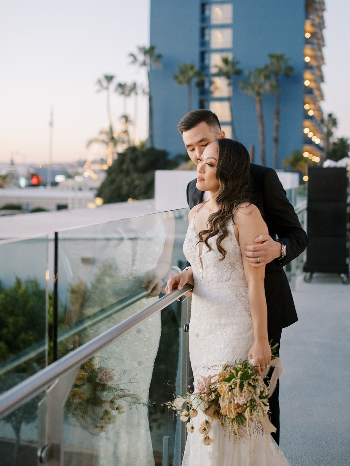 Bride and groom looking at the ocean in San Diego