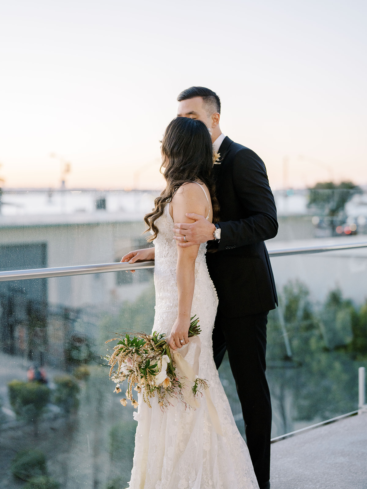 Bride and Groom looking at the ocean at the Lane